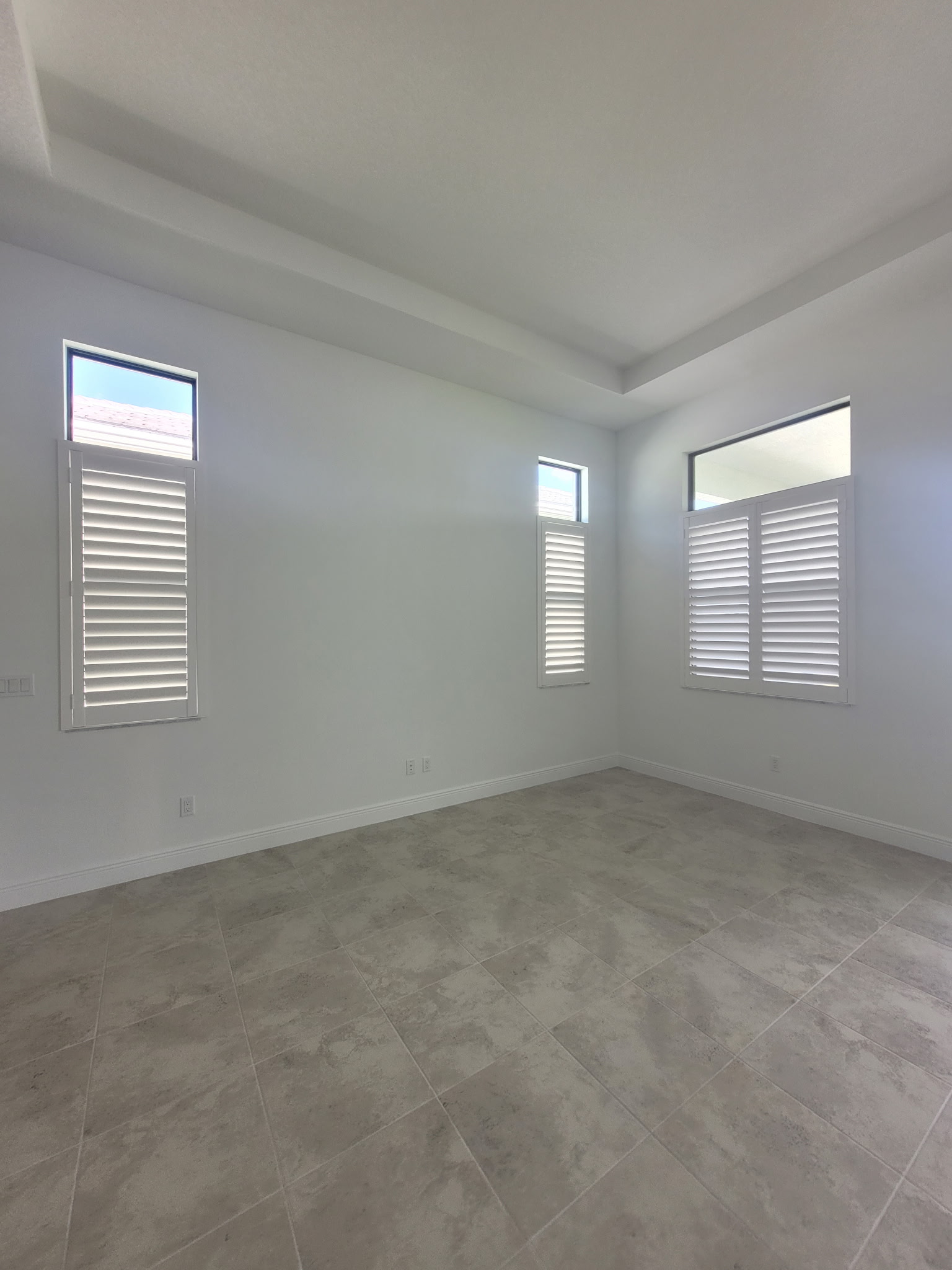 Custom plantation shutters in Sarasota home, enhancing light control and privacy.