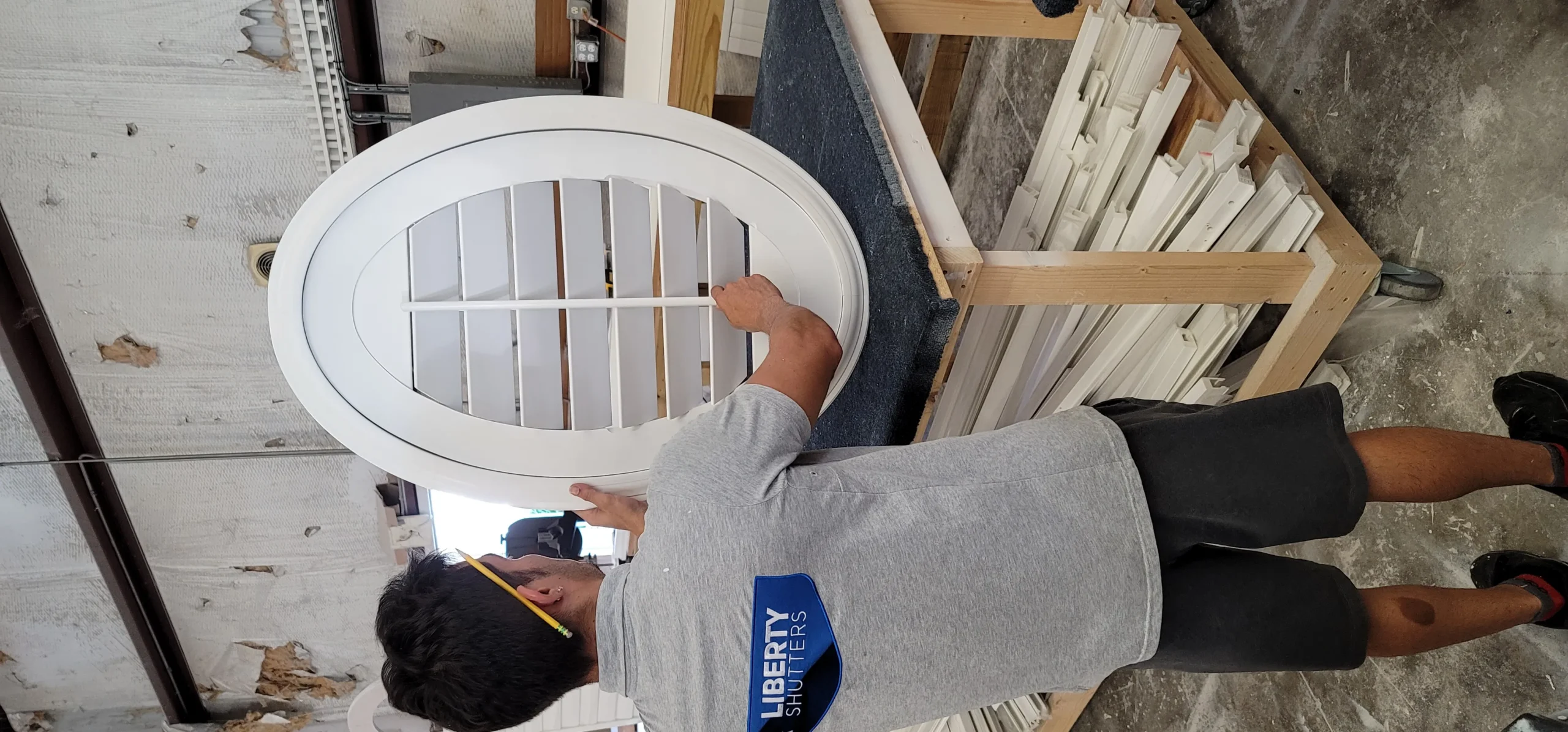 Professional team installing plantation shutters in a Florida home