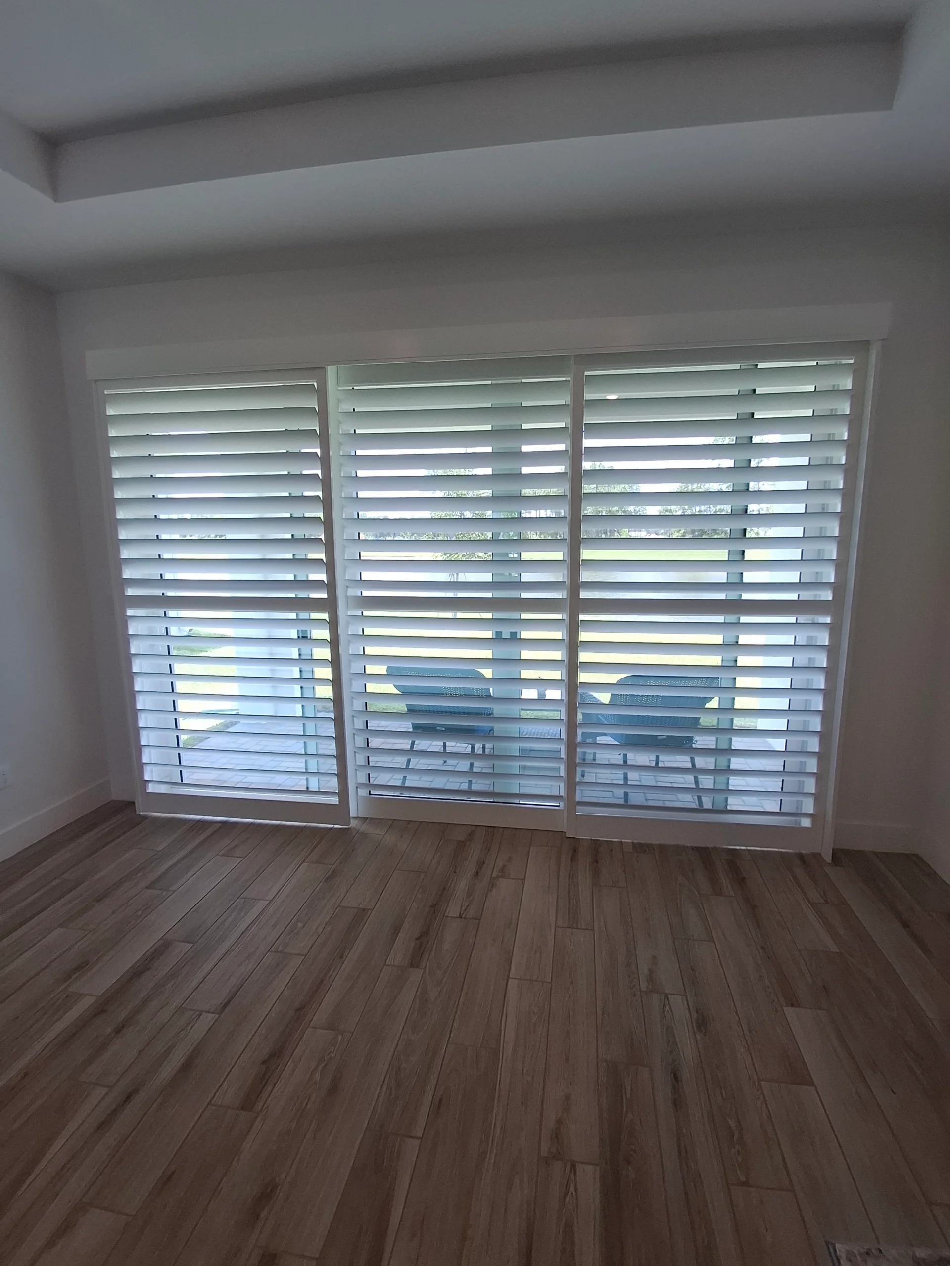 Custom white plantation shutters installed by Liberty Shutters