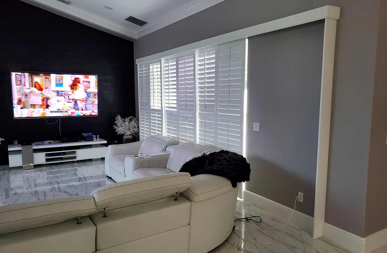 Sliding plantation shutter panels installed in a contemporary Florida home