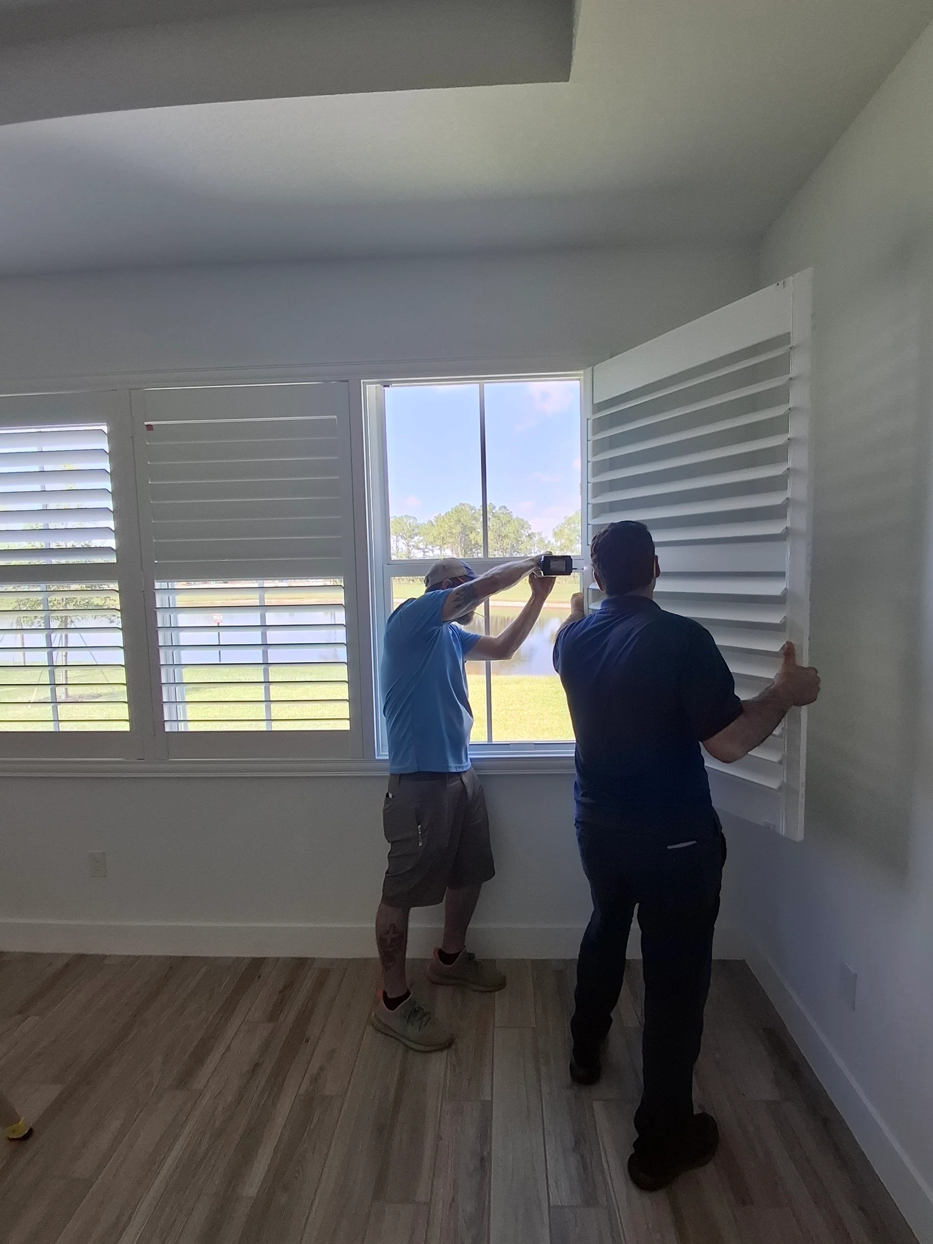 Faruk and Phil at a Liberty Shutters installation