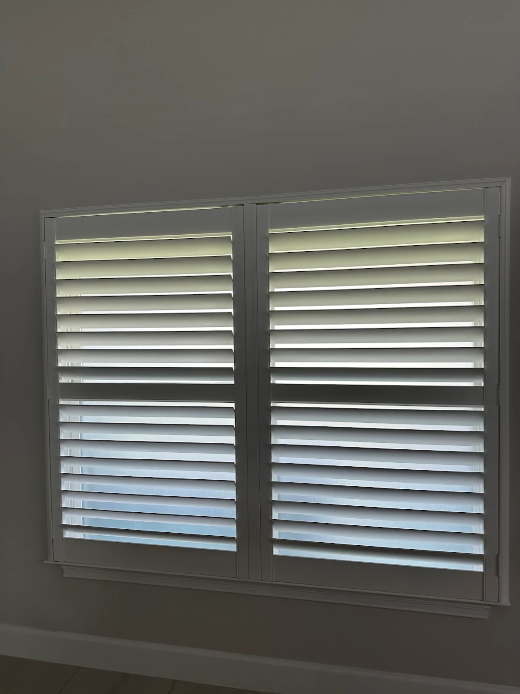 Custom white plantation shutters installed by Liberty Shutters